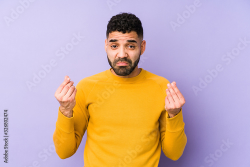 Young mixed race arabic man isolated showing that she has no money.