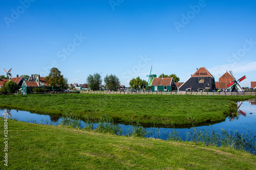 Zaanse Schans, Netherlands - 1 October 2019: Traditional Dutch rural houses in Zaanse Schans, a typical small village within Amsterdam area.