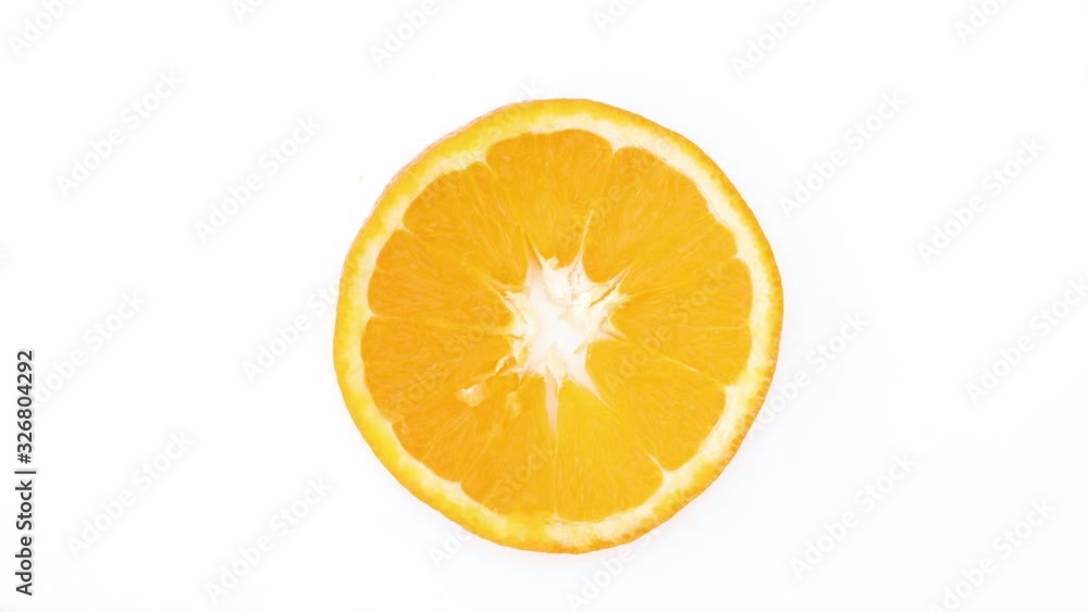 Fresh citrus sliced orange rotating. Spinning sliced orange - Close up stop motion Fresh citrus sliced orange rotating. Spinning sliced orange - Close up stop motion