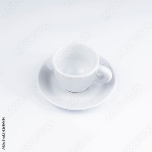Small white coffee cup on a white background.