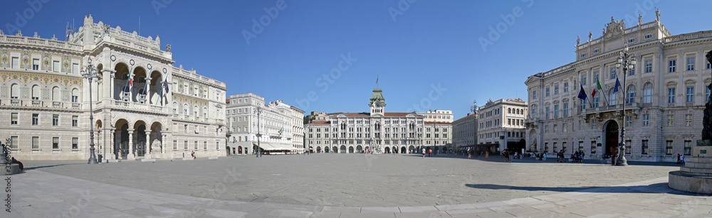 Panoramic photo of Piazza Unita di Italia (Unity of Italy Square) Large square in Trieste, Italy. A seaport city in northeast Italy. Unrecognizable people / tourists