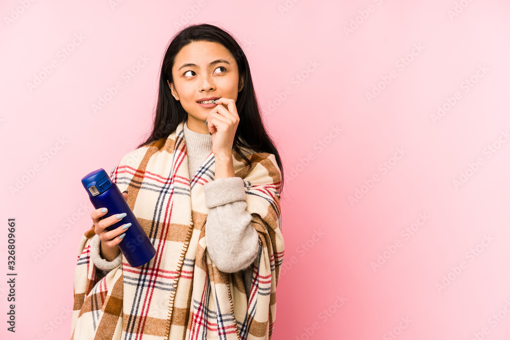 Young chinese woman doing a camping isolated on pink background feels proud and self confident, example to follow. Young chinese woman doing a camping isolated on pink background feels proud and self confident, example to follow.