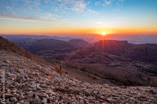 Beautiful scenery landscape. Mountain view at sunset over the desert mountains at Wadi Musa, Hashemite Kingdom of Jordan. The edge between the golden and blue hours