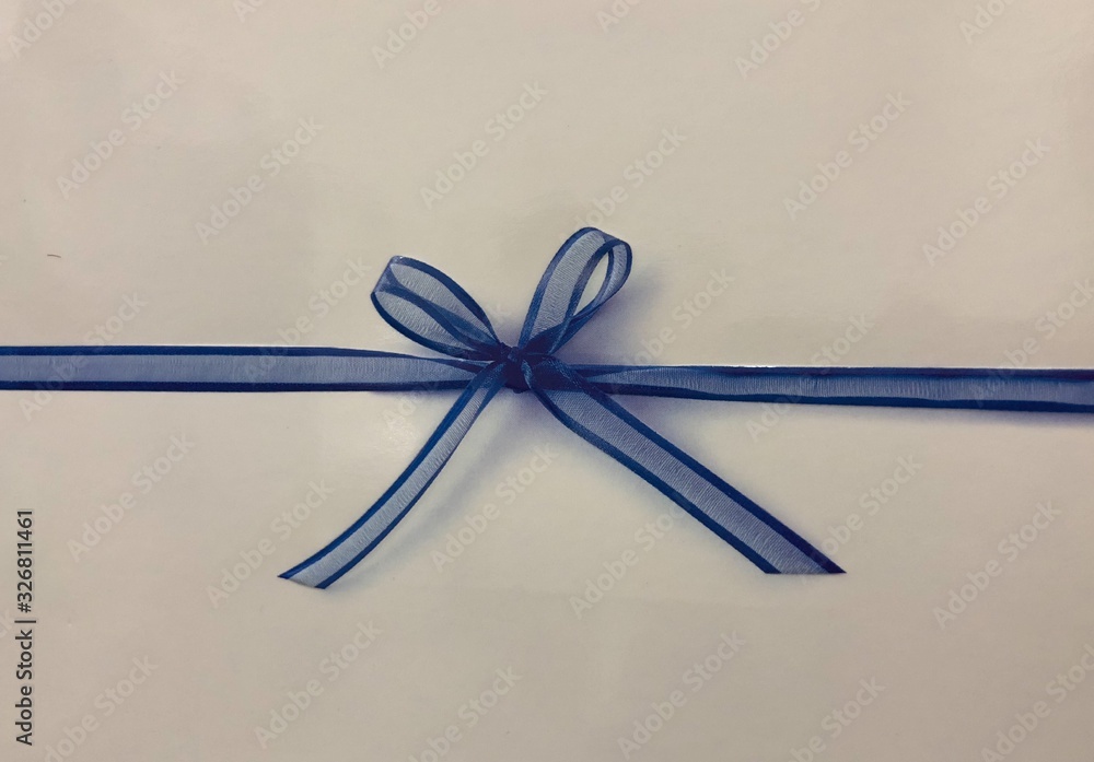 blue ribbon and bow on white background blue ribbon and bow on white background