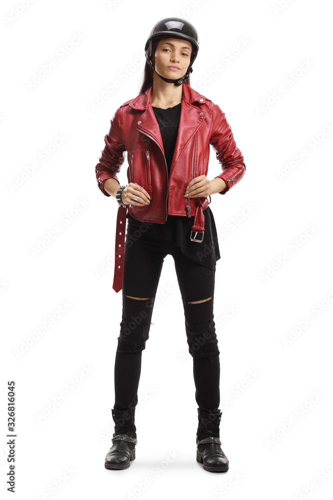 Female biker with a helmet standing and posing Female biker with a helmet standing and posing