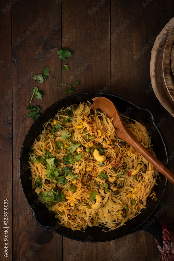 Indian vermicelli upma cooked in cast iron pan