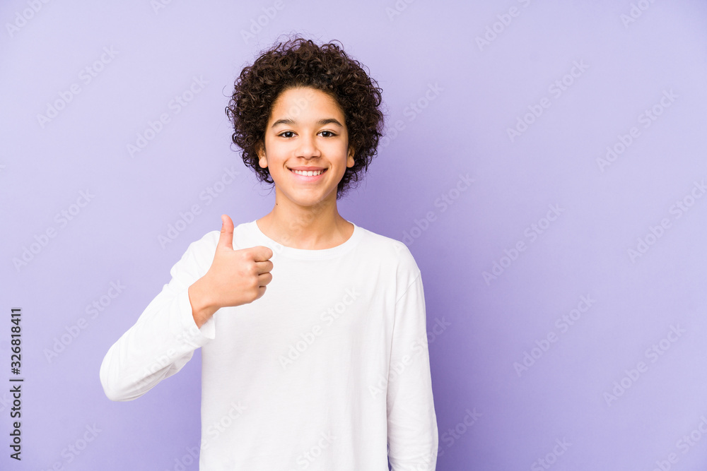 African american little boy isolated smiling and raising thumb up African american little boy isolated smiling and raising thumb up