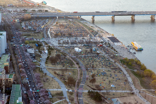 Crowds of people at Seoul cherry blossom festival aerial photo