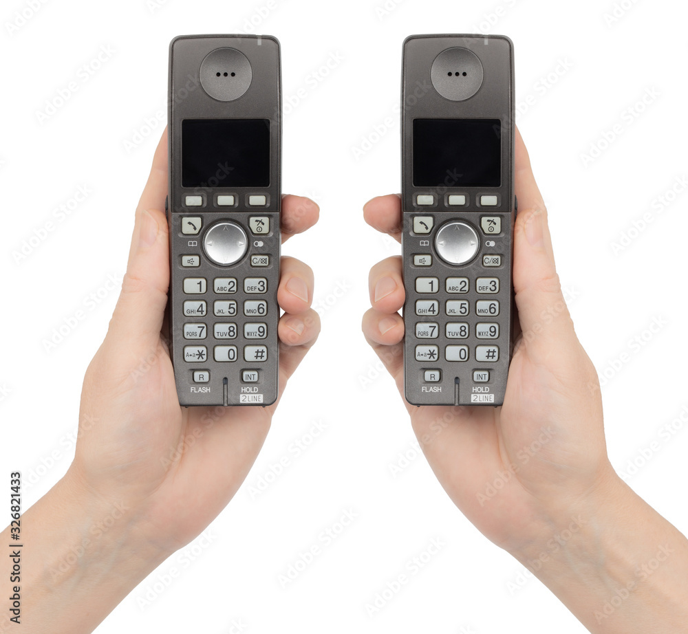 Female hands holds a phones, isolated on white background Female hands holds a phones, isolated on white background