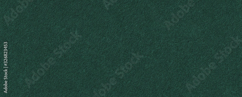 Seamless dark green felt background texture. Surface of snooker or poker table. Wide green panoramic banner.
