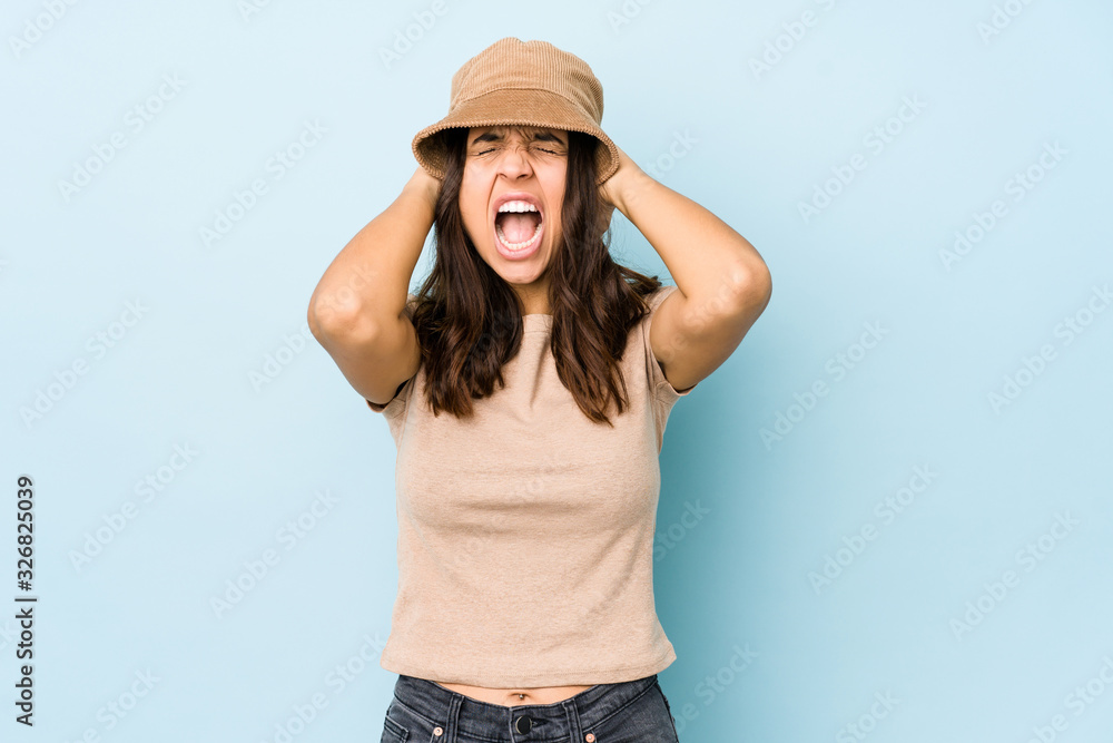 Young mixed race hispanic woman isolated covering ears with hands trying not to hear too loud sound. Young mixed race hispanic woman isolated covering ears with hands trying not to hear too loud sound.