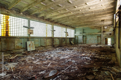 Abandoned school gym in ghost town Pripyat Chornobyl Zone photo