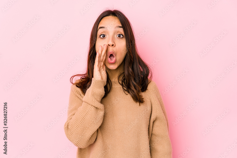 Young mixed race hispanic woman isolated is saying a secret hot braking news and looking aside Young mixed race hispanic woman isolated is saying a secret hot braking news and looking aside