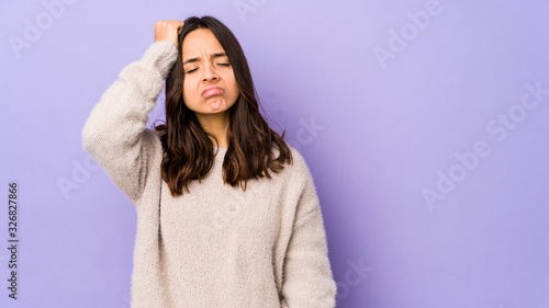 Young mixed race hispanic woman isolated tired and very sleepy keeping hand on head. © Asier