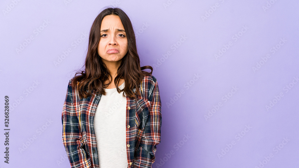 Young mixed race hispanic woman isolated sad, serious face, feeling miserable and displeased. Young mixed race hispanic woman isolated sad, serious face, feeling miserable and displeased.