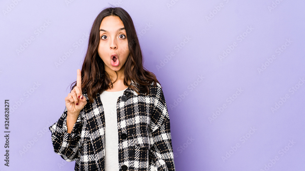 Young mixed race hispanic woman isolated pointing upside with opened mouth.