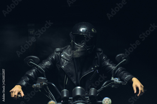  motorcyclist with smoke in the dark