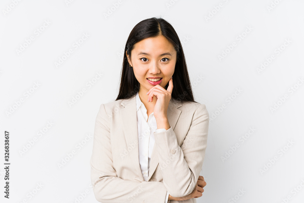 Young chinese business woman isolated smiling happy and confident, touching chin with hand. Young chinese business woman isolated smiling happy and confident, touching chin with hand.