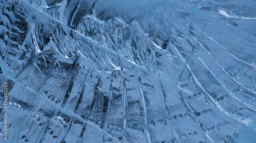 Ice block wall close up textured surface background. Cool blue bricks