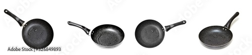 Frying pan with drops of water on an isolated white background.