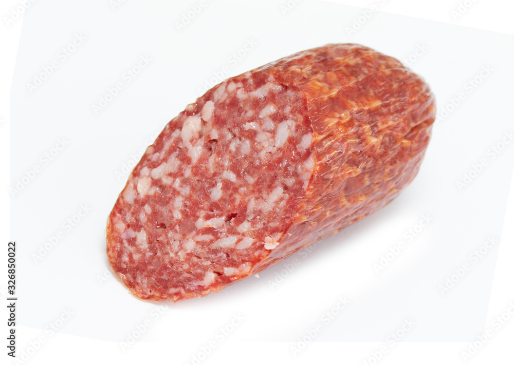 Slice of smoked salami sausage isolated on a white background. Slice of smoked salami sausage isolated on a white background.