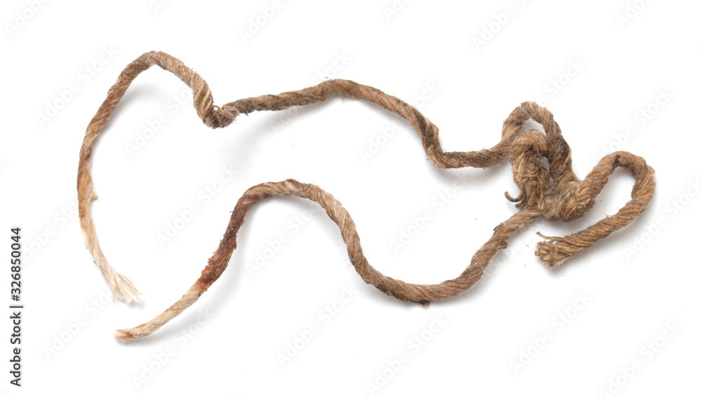 Old dirty twine rope on a white background. Old dirty twine rope on a white background.