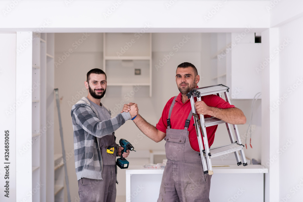 workers giving high five to each other workers giving high five to each other