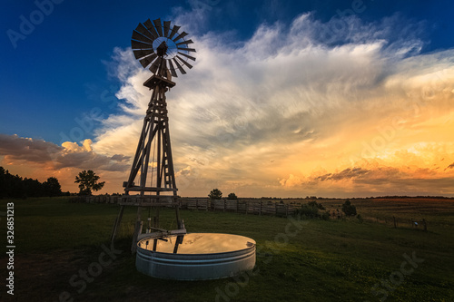 windmill at sunset before a storm