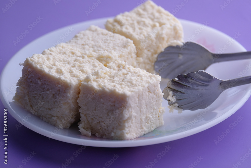 Close up of homemade indian sweet on color background 
