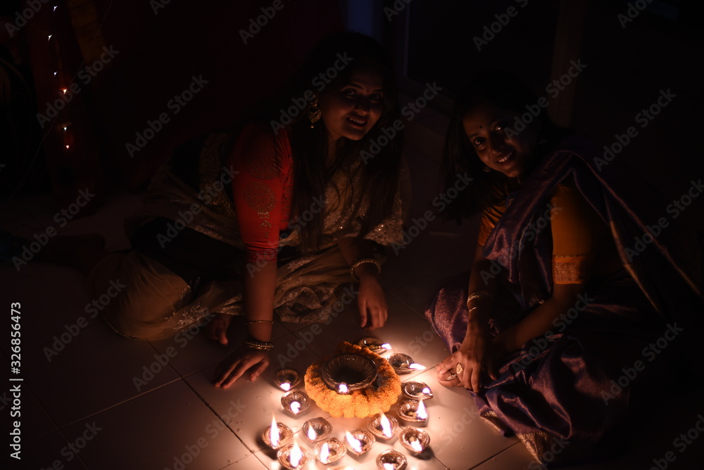 Two beautiful Indian Bengali women in Indian traditional dress are