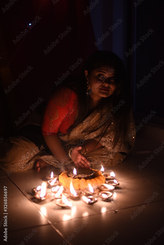An young and beautiful Indian Bengali woman in Indian traditional dress