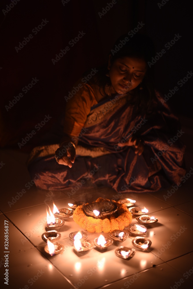 An young and beautiful Indian Bengali woman in Indian traditional dress