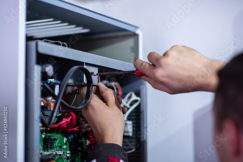 electrician engineer working with electric cable wires