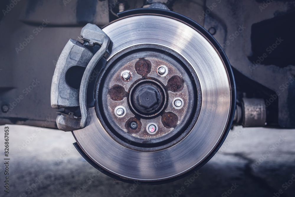 car brake disc with brake pad. rusty brake disc.