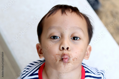 Bilde på lerret Cute little boy with his lips puckered up and kiss