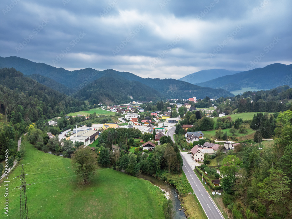 Beautiful panoramic view of small town situated between hills and mountains in Lower Austria.