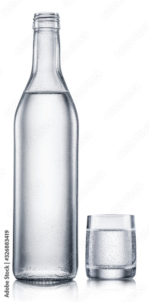 Glass and bottle of vodka, chilled alcohol drink, on white background. Clipping path. Glass and bottle of vodka, chilled alcohol drink, on white background. Clipping path.