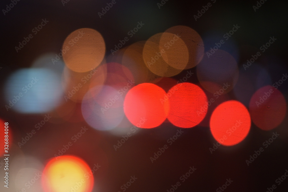 Fototapeta premium background of bokeh abstract colourful red, gold, blue and black glitter lights. defocused