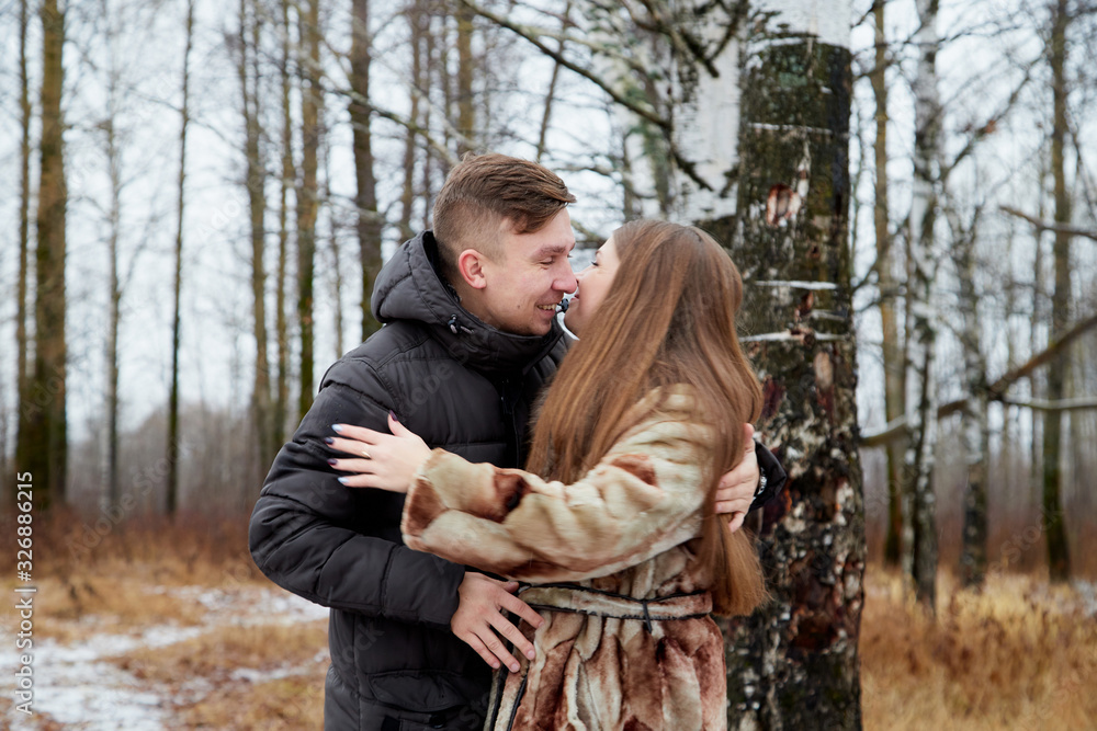 Romantic couple in love on autumn or winter walk Romantic couple in love on autumn or winter walk