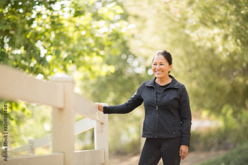 Portrait of a fit Asian woman exercising.