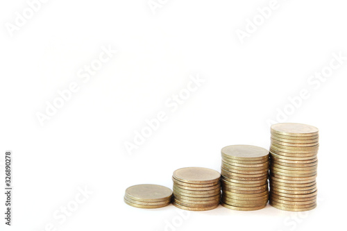 Increasing columns of gold coins isolated on white background