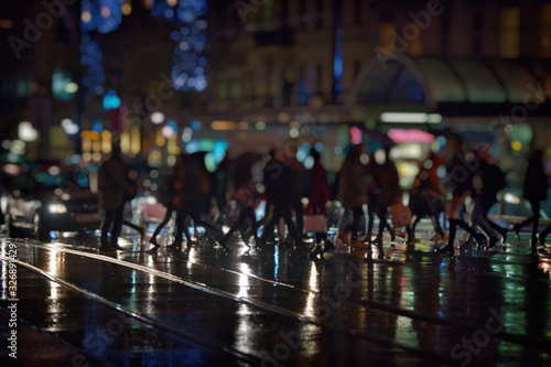 crowd of people on night street in the city