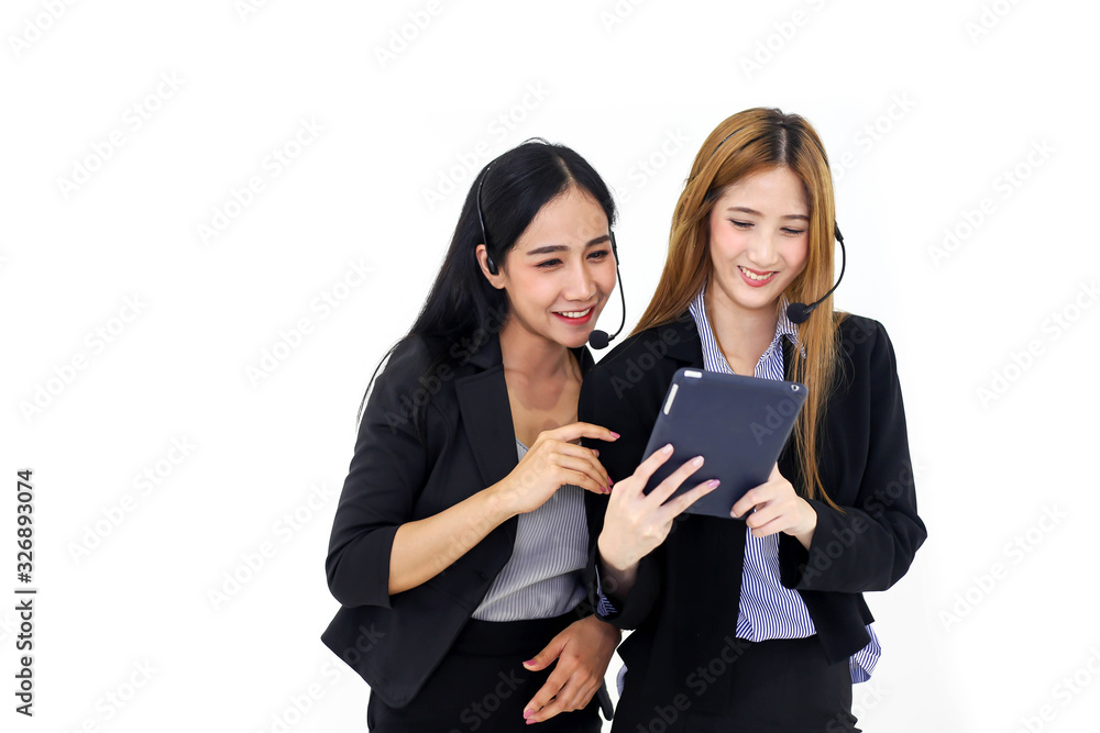 Couple Asia call center workers or Confident business with headset and tablet,Customer support standing on white background. Couple Asia call center workers or Confident business with headset and tablet,Customer support standing on white background.
