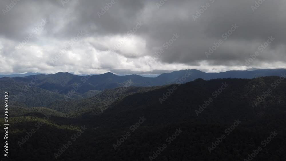 View of the dense clouds over the mountains of Papua, aerial view. View of the dense clouds over the mountains of Papua, aerial view.