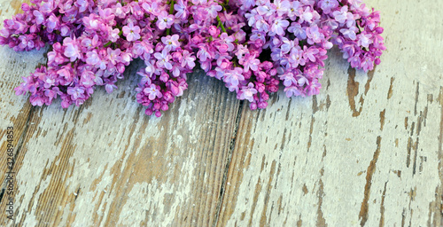 Fresh lilac on a wooden background