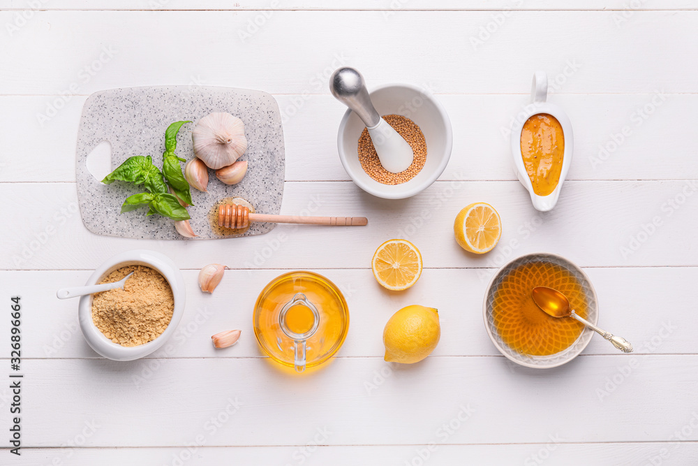 Ingredients for honey mustard sauce on white wooden background Ingredients for honey mustard sauce on white wooden background
