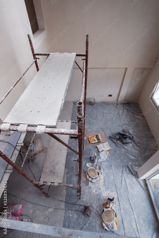 interior of construction site with scaffolding interior of construction site with scaffolding