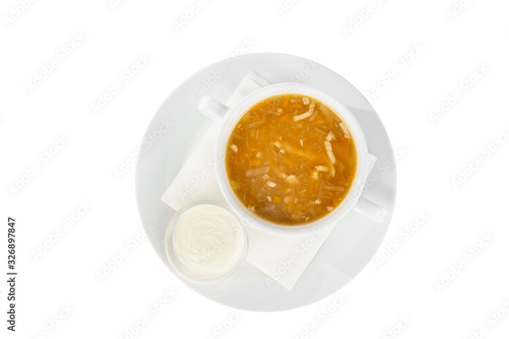 Soup transparent with chicken, fish, cabbage soup, in plate isolated white and sour cream, on a napkin. Serving dishes in a cafe, restaurant, for a menu. View from above Soup transparent with chicken, fish, cabbage soup, in plate isolated white and sour cream, on a napkin. Serving dishes in a cafe, restaurant, for a menu. View from above