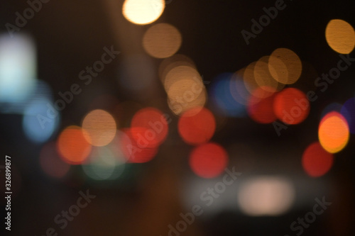 background of bokeh abstract colourful red, gold, blue and black glitter lights. defocused © Pracha