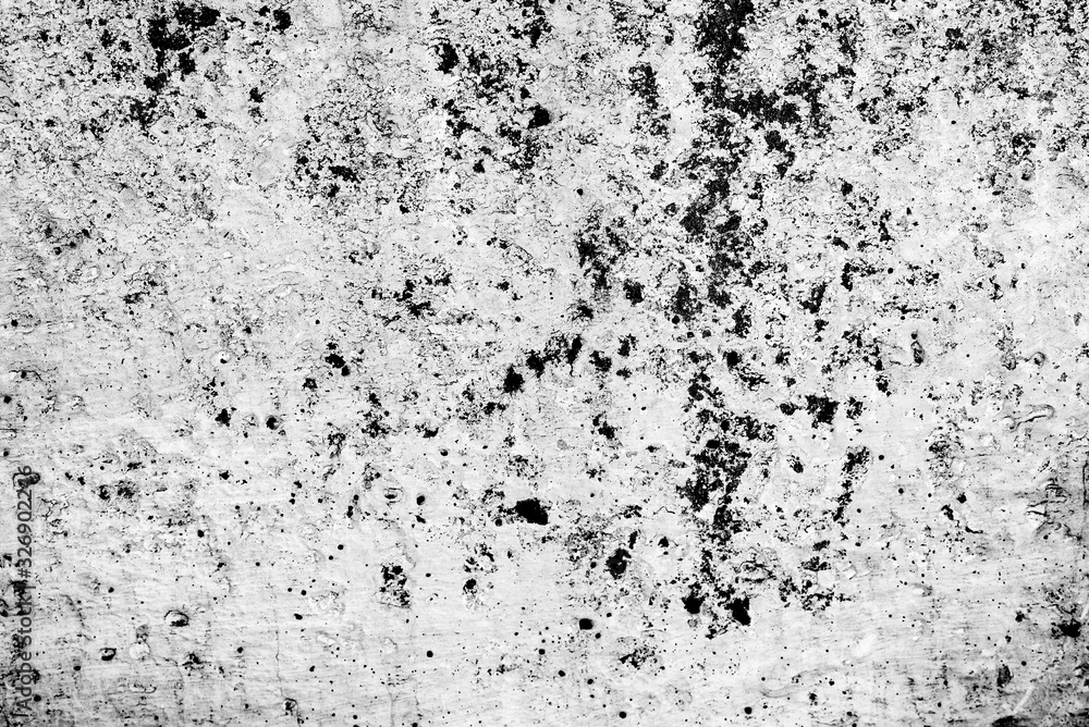 Texture of a concrete wall with cracks and scratches which can be used as a background Texture of a concrete wall with cracks and scratches which can be used as a background
